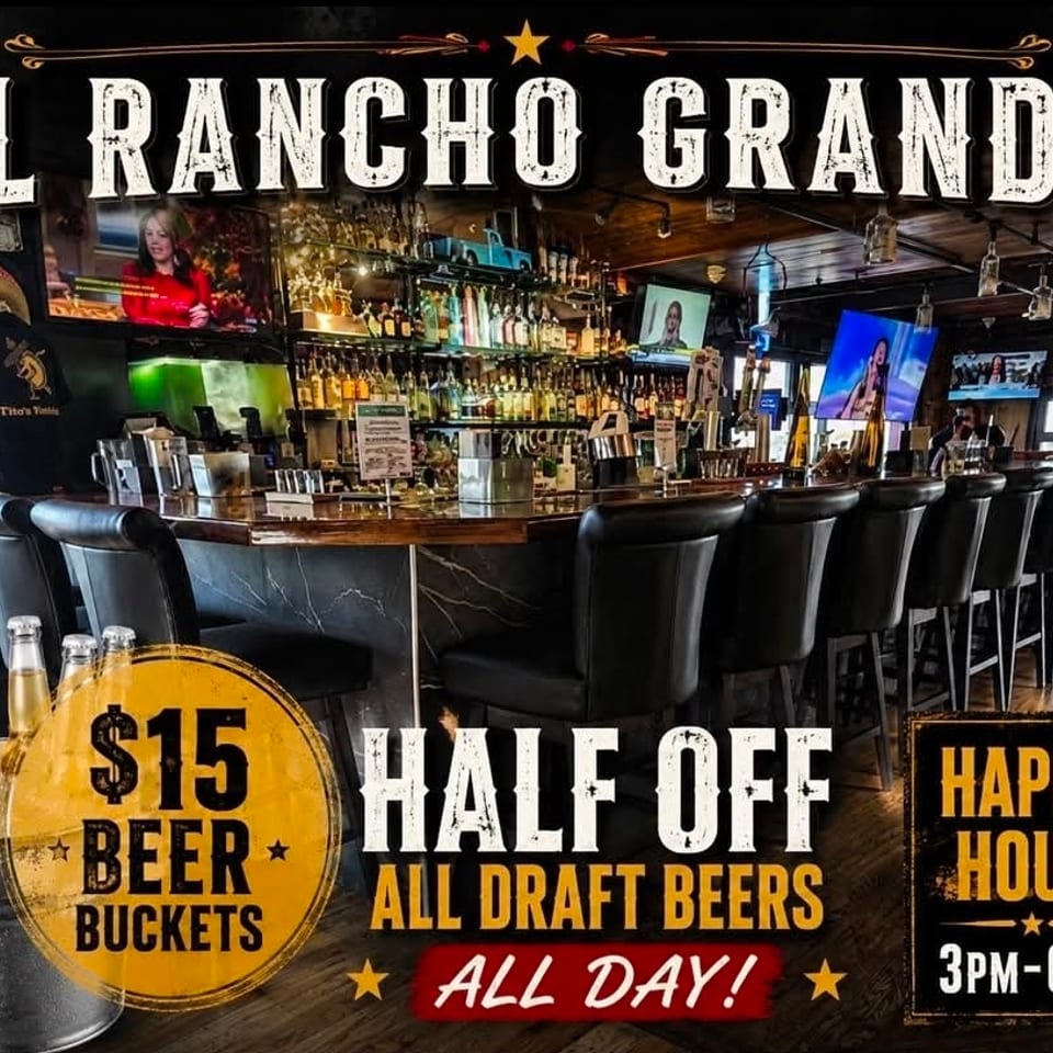 El Rancho Grande bar interior with leather stools, liquor shelves, televisions, and promotional signs for beer buckets and happy hour.